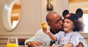 A father and son dining together at Disney World.