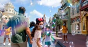 Family walking down Main Street U.S.A.