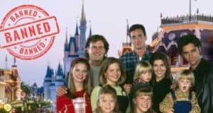 Full house actor with Disney Resort behind them with a stamp signed banned