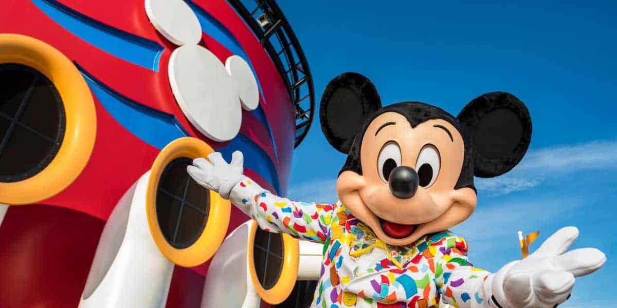 Mickey Mouse with a Disney Cruise Line ship
