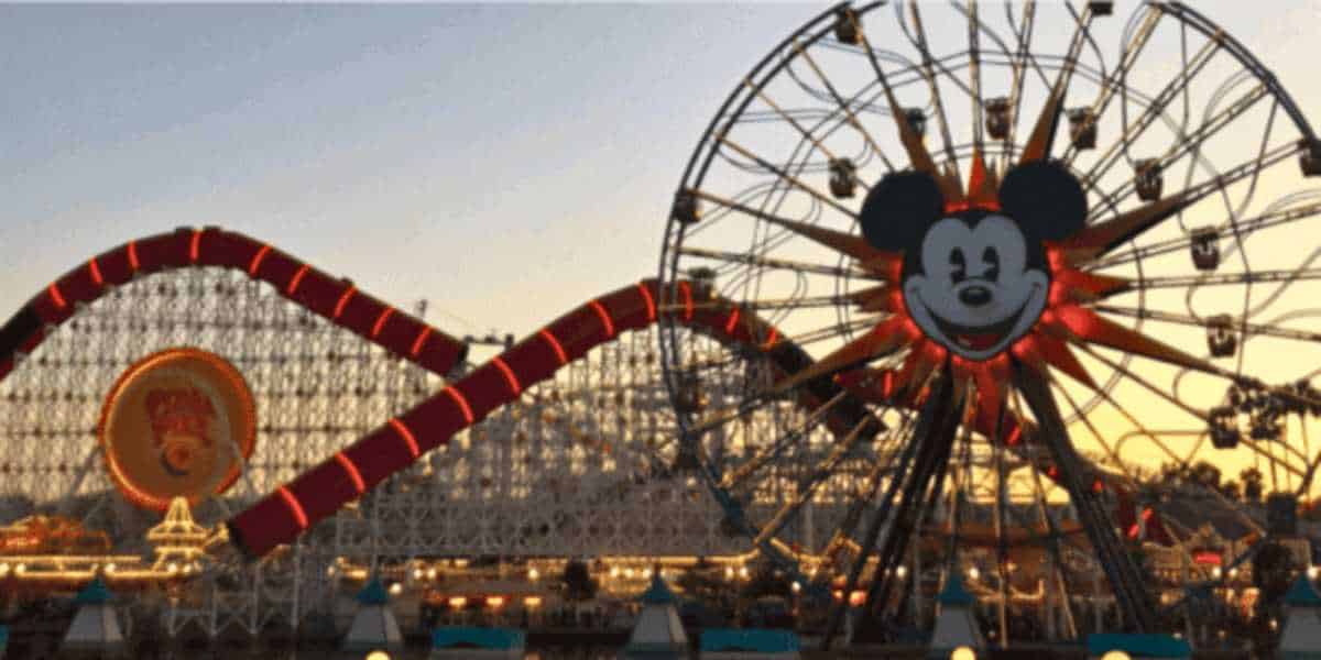 Mickey's Fun Wheel and Incredicoaster at dusk.