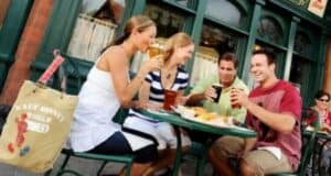 Guests drinking and eating at the Rose and Crown at World Showcase's United Kingdom Pavilion