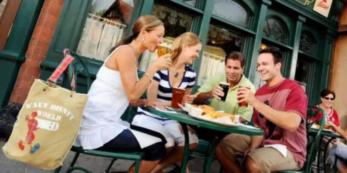 Guests drinking and eating at the Rose and Crown at World Showcase's United Kingdom Pavilion