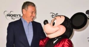 Bob Iger and Mickey Mouse smile at each other