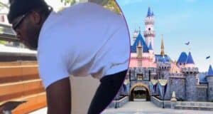 A person lifting a table, Sleeping Beauty Castle at Disneyland.