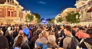 Crowds at Disneyland Park in front of Sleeping Beauty Castle