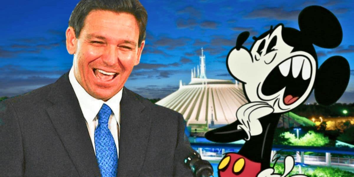 Disney and DeSantis, laughing while Mickey Mouse looks scared, in front of Space Mountain at Walt Disney World Resort. The DeSantis Disney battle.