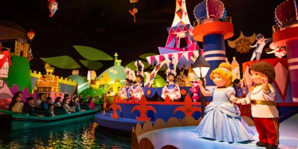 Guests enjoy a ride on "it's a small world," surrounded by colorful, animated dolls representing different cultures from around the world.
