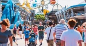 People walk through Tomorrowland at Magic Kingdom