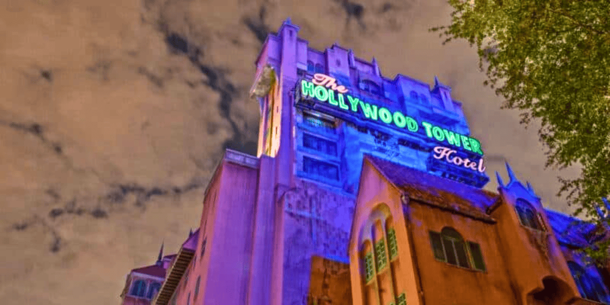 Tower of Terror lit up on a cloudy night