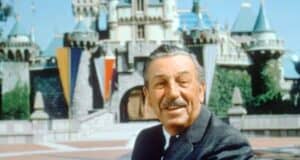 Walt Disney in front of Sleeping Beauty Castle