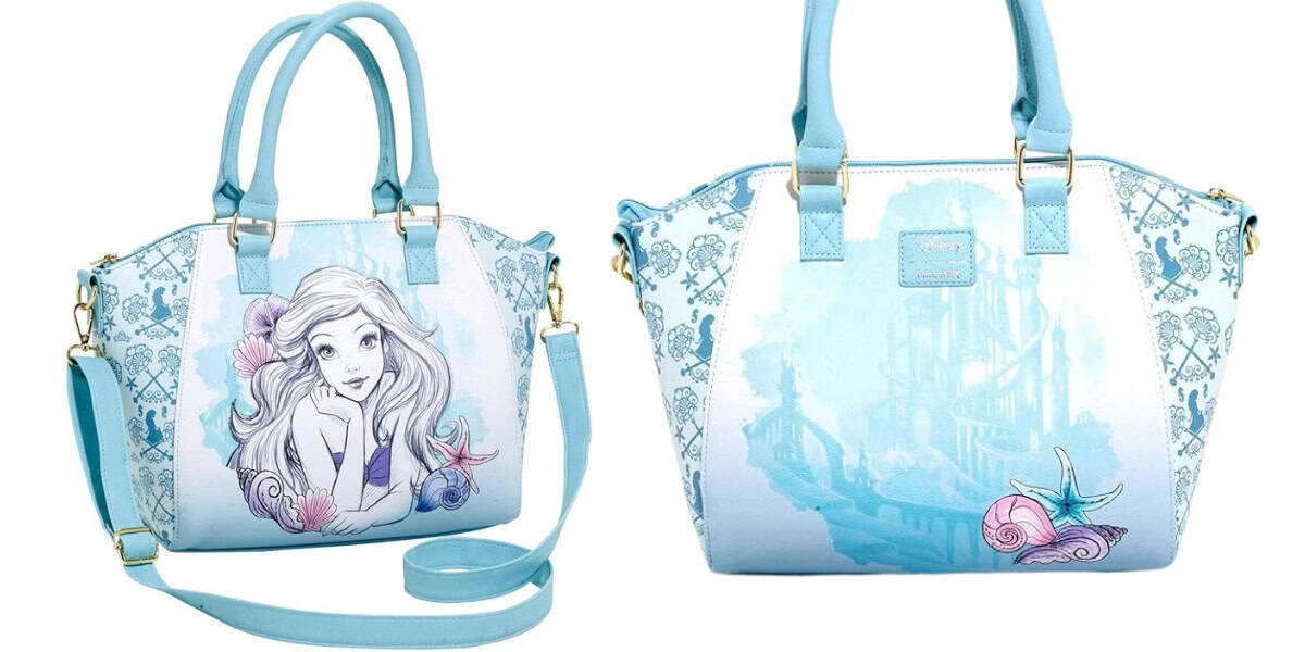 Two light blue handbags with illustrations. The left bag features a drawing of a mermaid with flowing hair, while the right bag showcases a detailed castle design adorned with seashell embellishments. Both bags have handles and detachable straps.