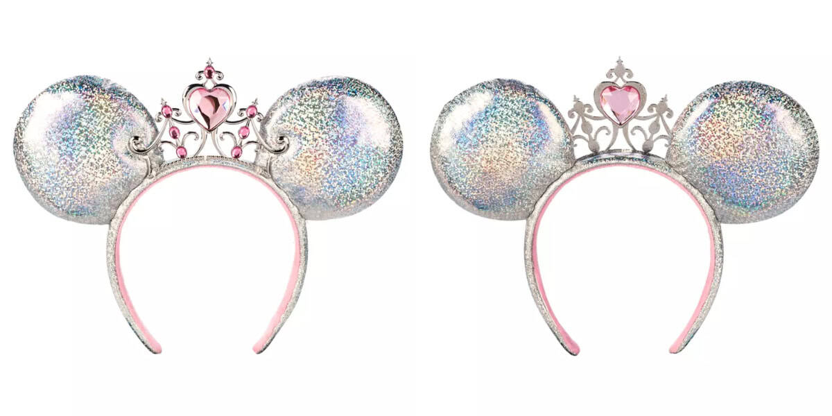 Two sparkly silver headbands, each with large sequin-covered ears. The left headband has a pink heart-shaped tiara, while the right one has a simpler tiara design. Both have a pink interior lining.