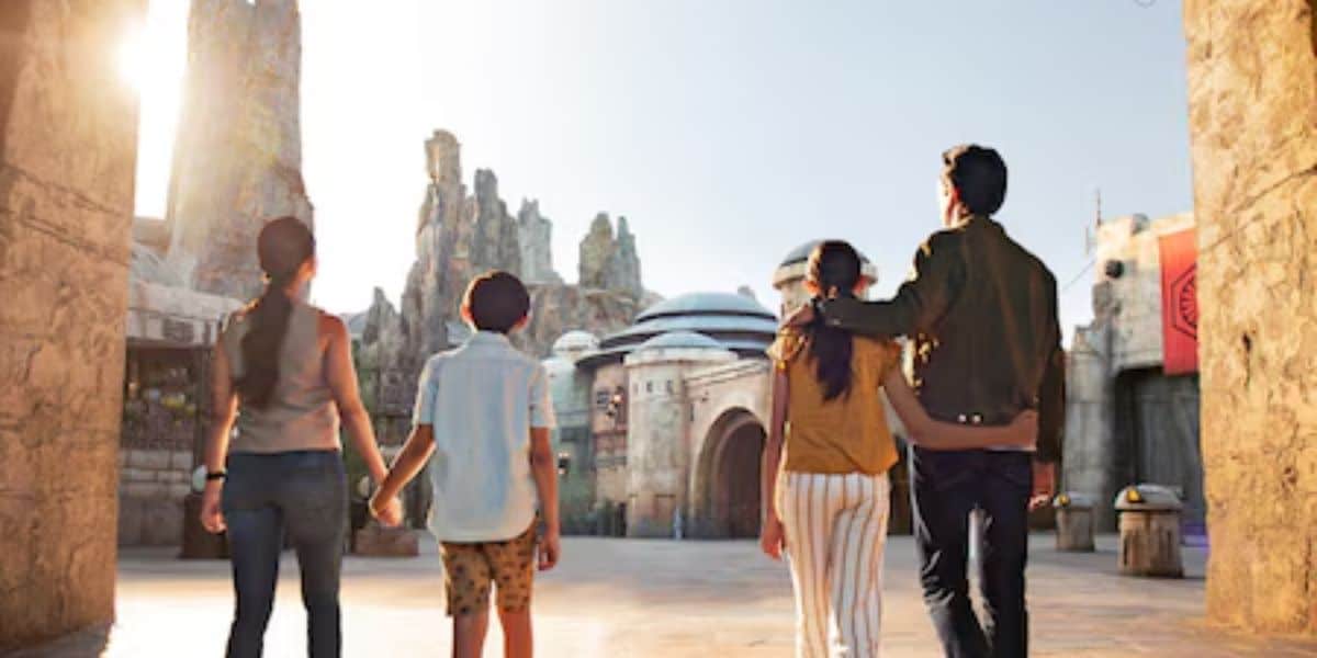 A family walking through Star Wars: Galaxy's Edge at Disneyland.