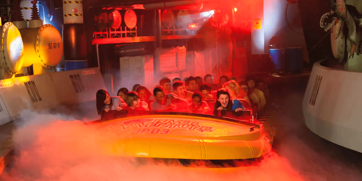 Passengers on the Jurassic Park River Adventure attraction at Universal Studios