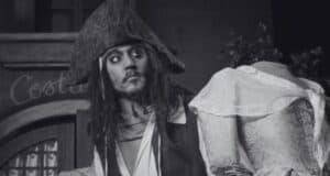 A black & white image of a Jack Sparrow animatronic on the Pirates of the Caribbean ride.