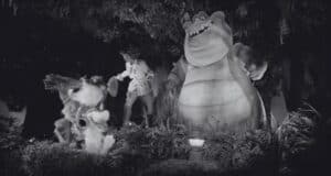 A black and white image of Princess Tiana, Louis, and an animal band on Tiana's Bayou Adventure.