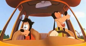A cartoon dog is happily driving a car with a big smile, while the dog in the passenger seat looks surprised or annoyed. They are in a bright orange vehicle, depicted in a lively animated style.