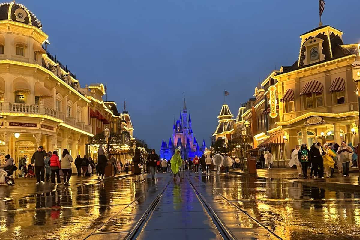 The reflection of Main Street, U.S.A., in the concrete at Magic Kingdom on a rainy day.