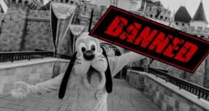 Black & white photo of Pluto in front of Sleeping Beauty Castle from Disneyland Park with text reading banned.