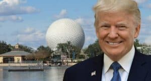A man in a suit stands smiling by the water's edge, with Epcot's iconic geodesic sphere and surrounding buildings in the background. The sky is partly cloudy, adding to the charm of this World Showcase scene.