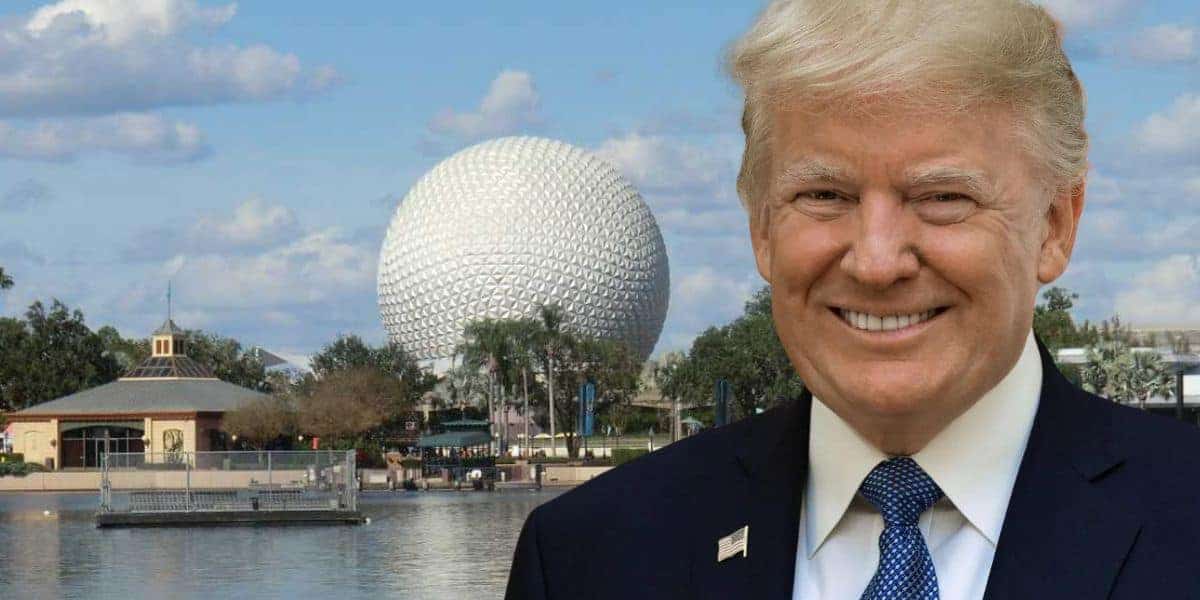 A man in a suit stands smiling by the water's edge, with Epcot's iconic geodesic sphere and surrounding buildings in the background. The sky is partly cloudy, adding to the charm of this World Showcase scene.