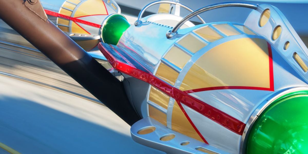 Close-up view of a colorful, futuristic Astro Orbiter ride vehicle.