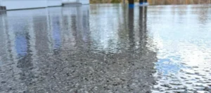 Shows durable, high-quality concrete coating by Duration Concrete Coatings by Duralast on an outdoor floor.