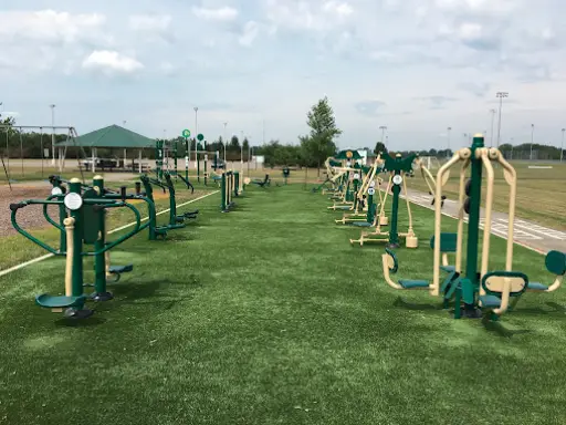 A park outdoor gym uses Duration Concrete Coatings by Duralast for safer, longer-lasting workout and play areas.