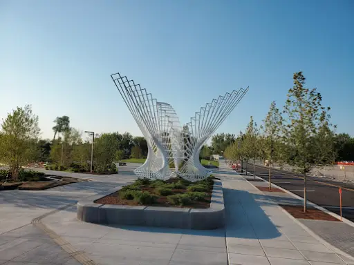 A public plaza with unique art and pathways, showing work done by Duration Concrete Coatings by Duralast.