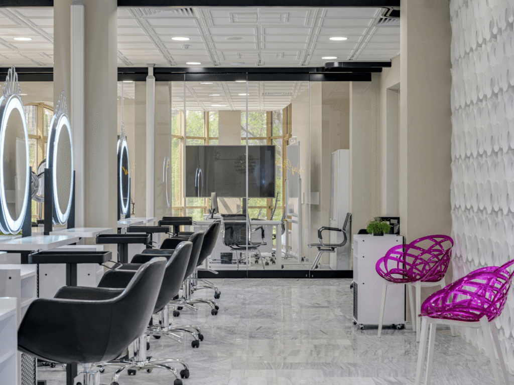 A stylish salon shows off marble floors by Duration Concrete Coatings by Duralast, creating a bright and welcoming space.
