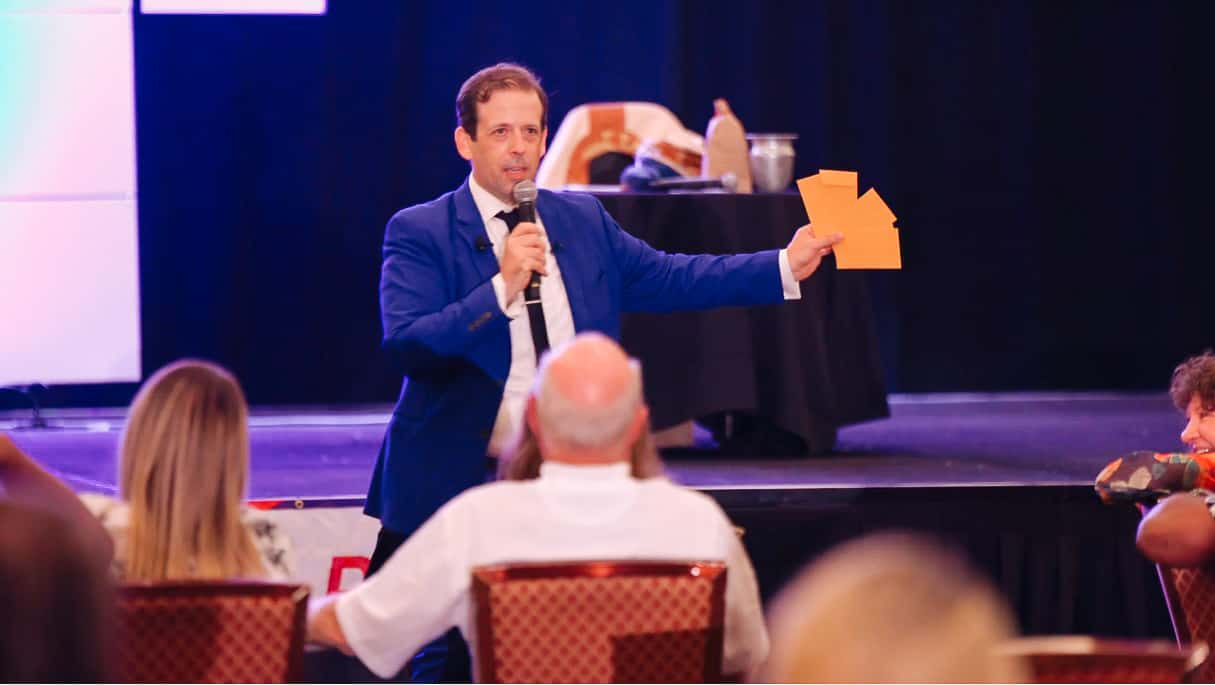 Guests in awe as the magician delivers a jaw-dropping illusion at a company event.