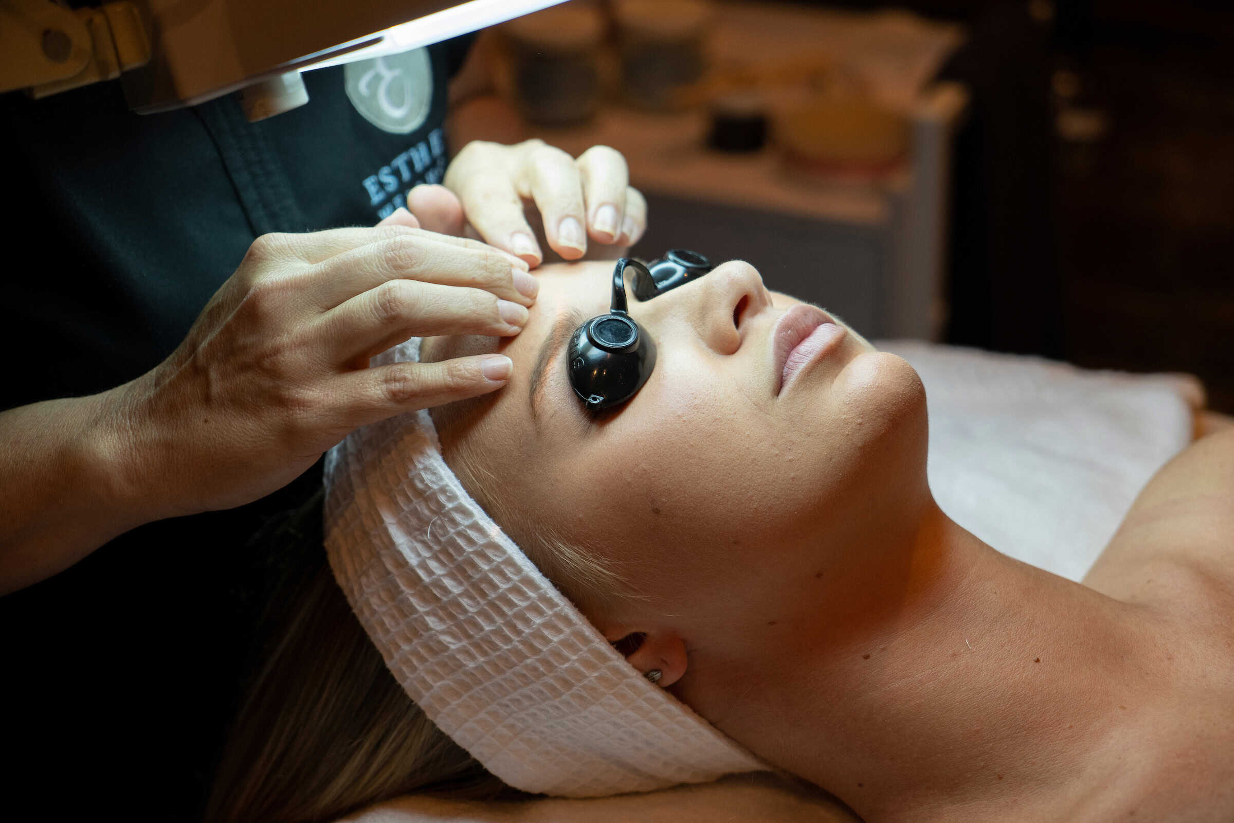 A woman getting a scalp treatment