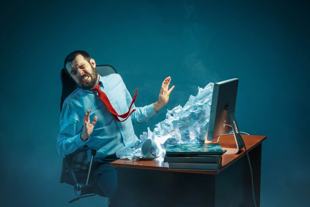 young man irritated by email spamming
