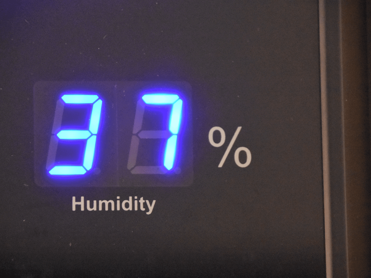 device showing 37% humidity level in a home