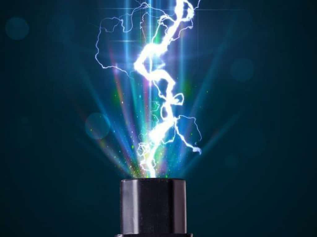 A white bolt of lightning emerges from a black cylindrical object against a dark background, surrounded by colorful light rays, illustrating the importance of surge protection in ensuring home electrical safety.