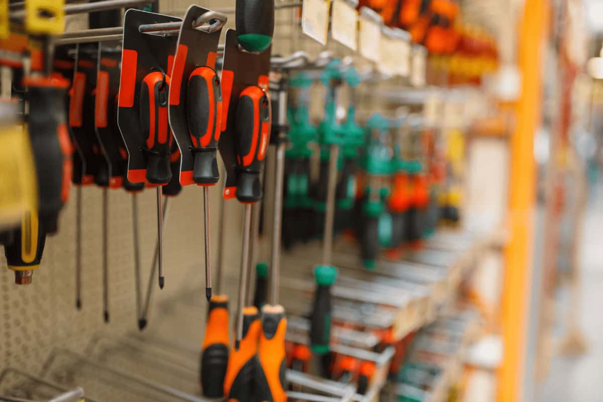 Hillside Metal screwdrivers are organized in a row on a display, showing the brand’s wide tool selection for metal roofing projects.