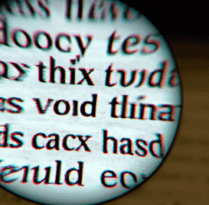 a magnifying glass looking up closely of text on a book as digital art in 4k