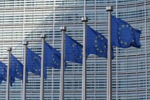 EU flags at the European Commission Berlaymont building, Photo by Guillaume Périgois