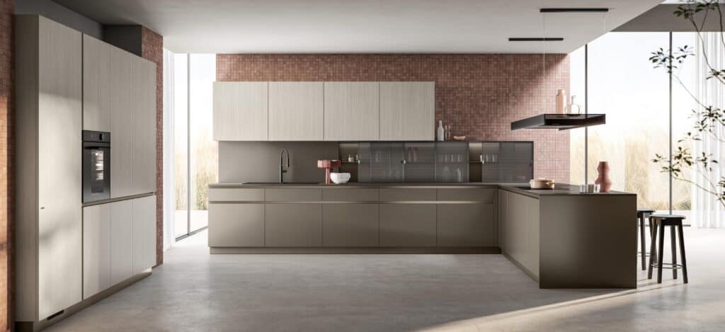 Modern kitchen with sleek cabinetry, large island, built-in oven, and minimalist decor.