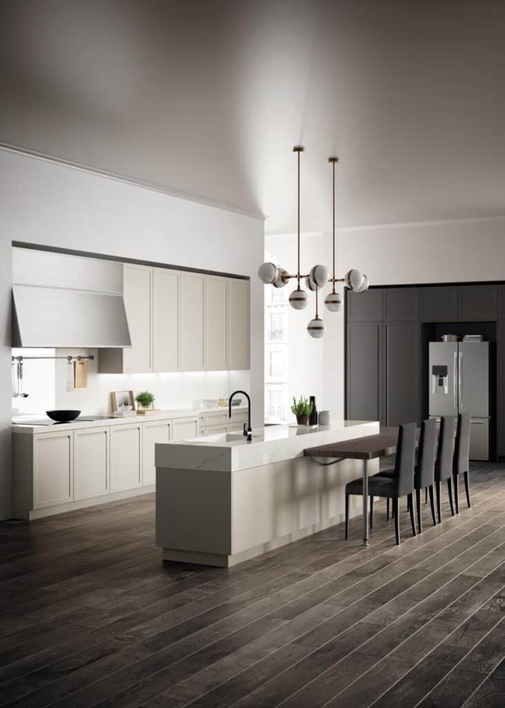 Modern kitchen with a large island, pendant lights, dark wooden floor, and sleek cabinetry, featuring a refrigerator and bar stools.