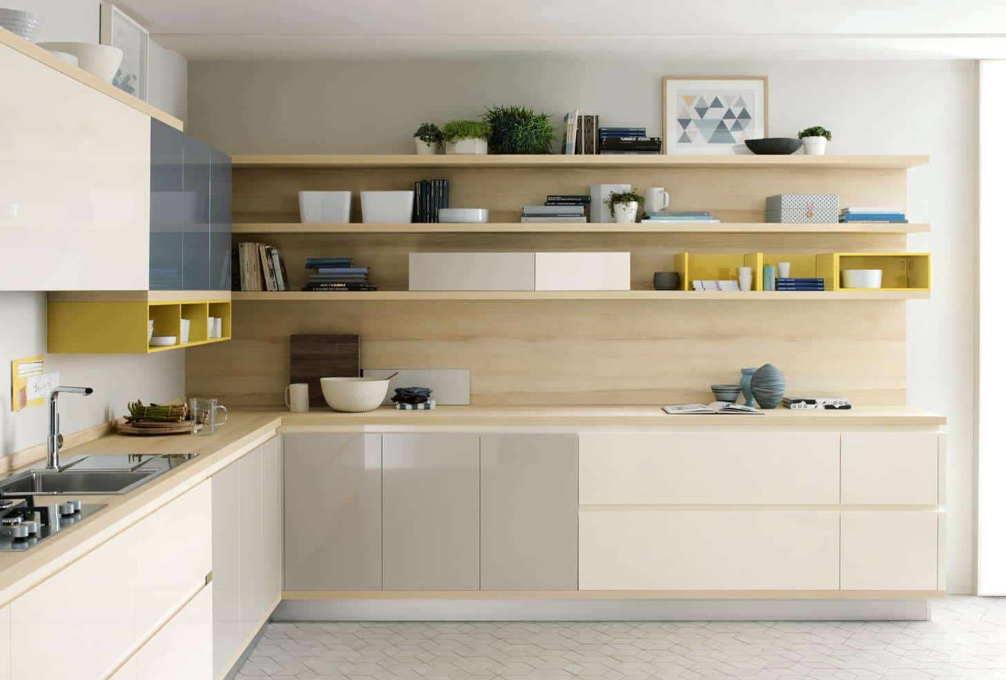 Modern kitchen with light wood cabinetry, open shelving, and minimalistic decor, featuring plants, books, and plates.