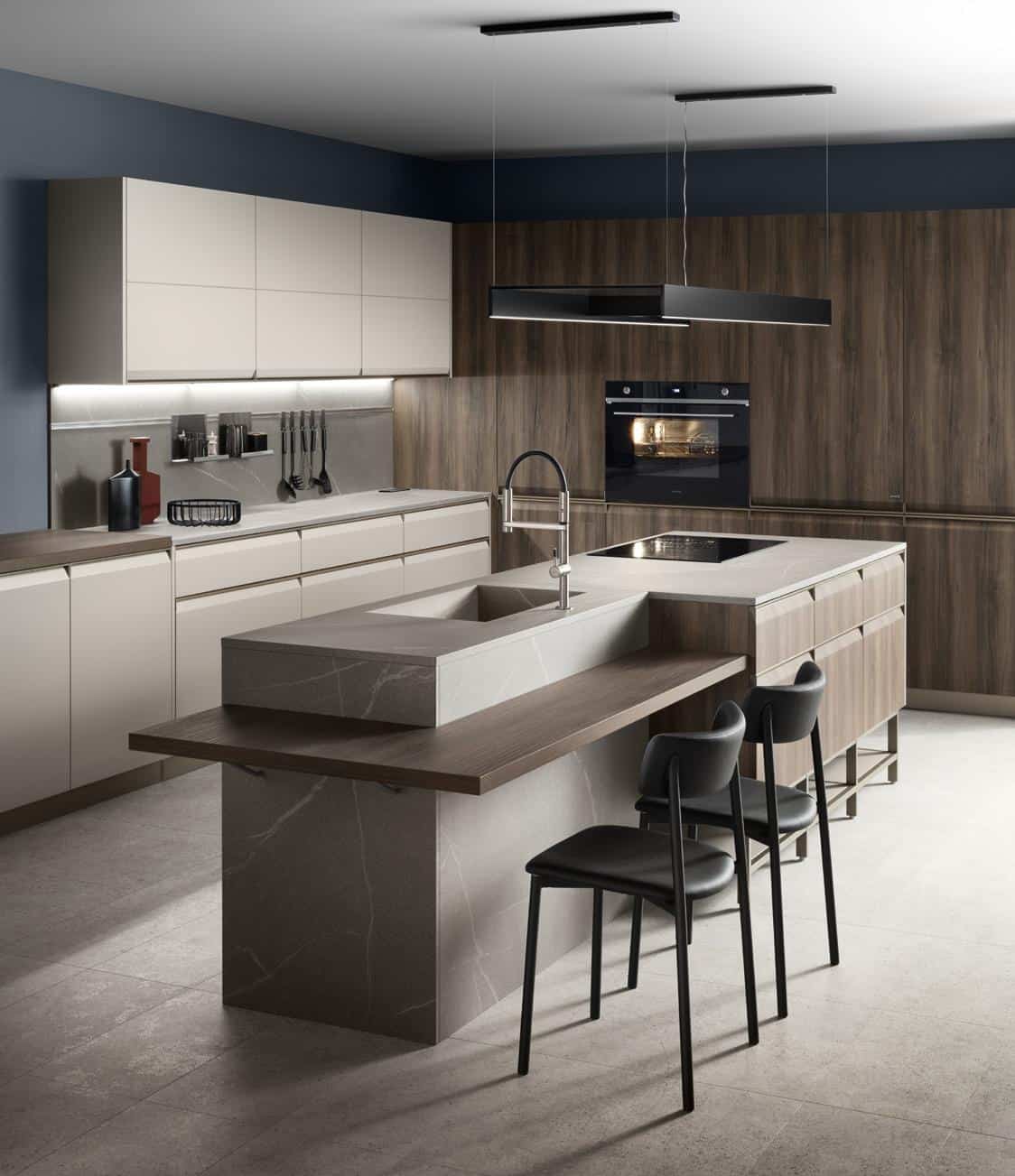 Modern kitchen interior with marble countertop, oak cabinets, a built-in oven, island with sink, and two black chairs.