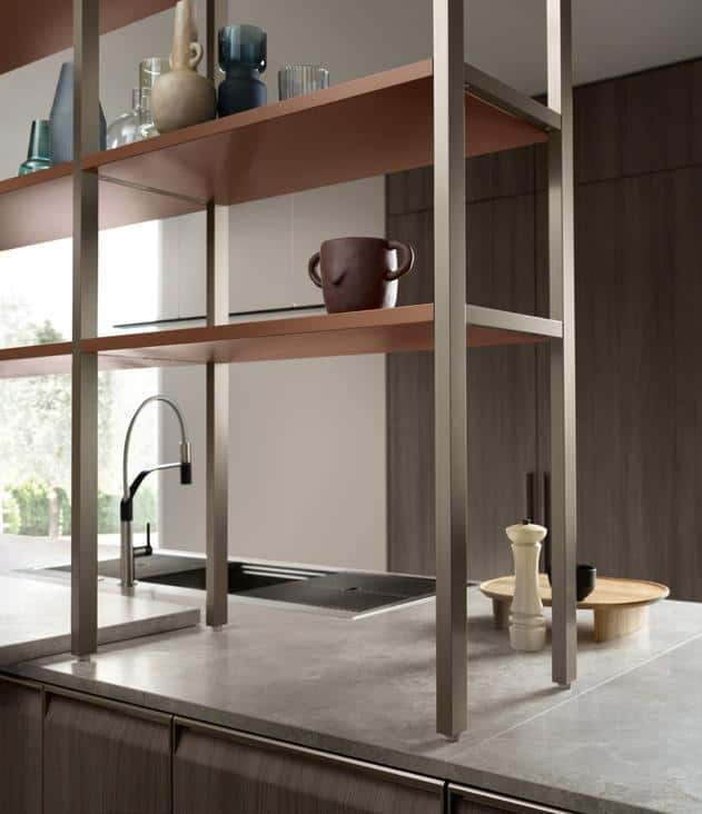 Modern kitchen with a stone countertop, metal shelving, various decorative vases, and a sink with a black faucet.
