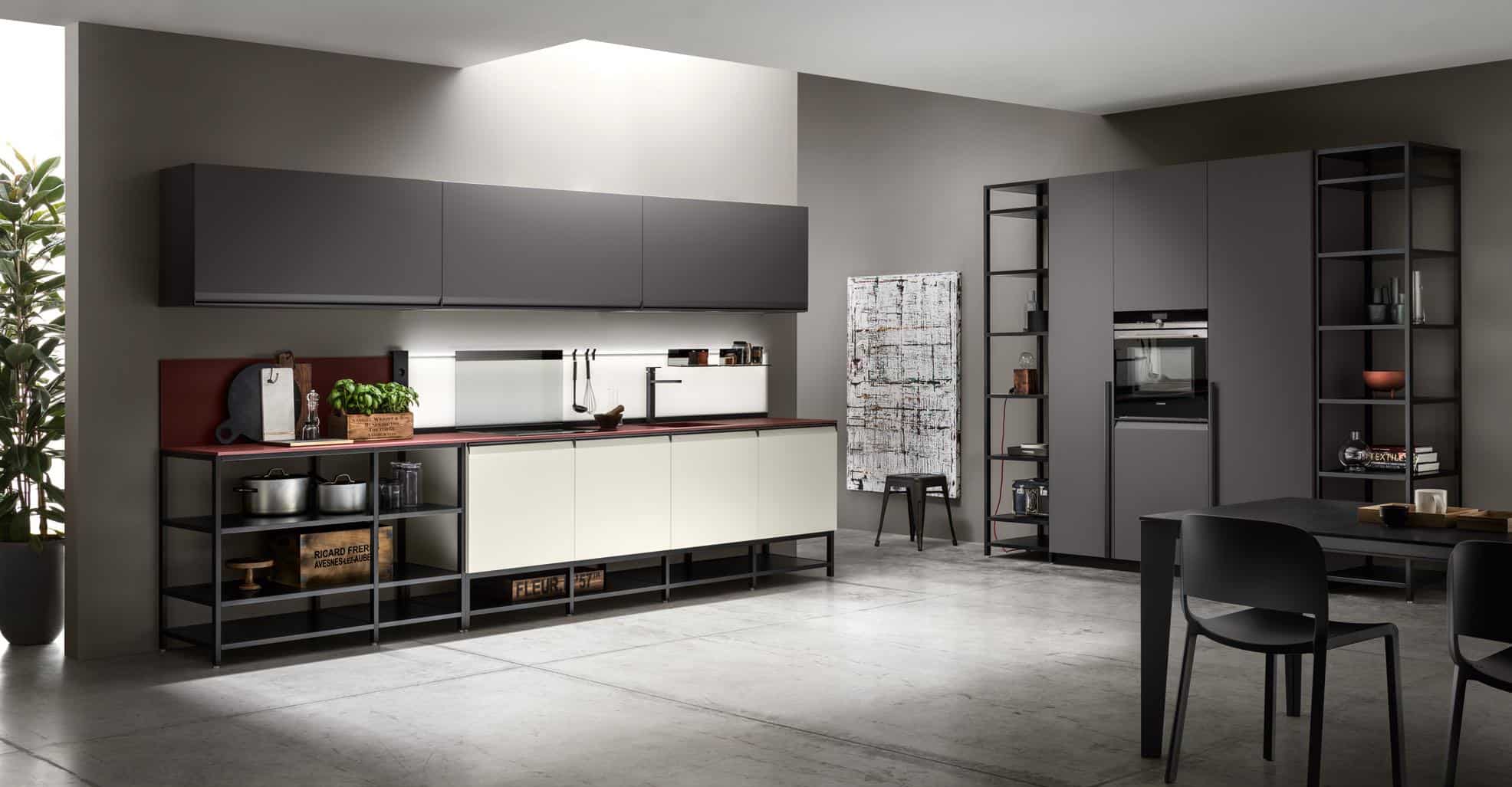 Modern kitchen interior with dark cabinetry, open shelving, and minimalist design.