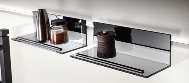 Two modern glass shelves with black back panels, each holding metal and ceramic jars.