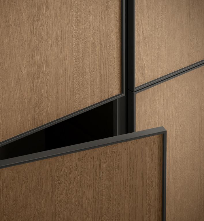 Close-up of wooden panels with black metal borders, one partially open.