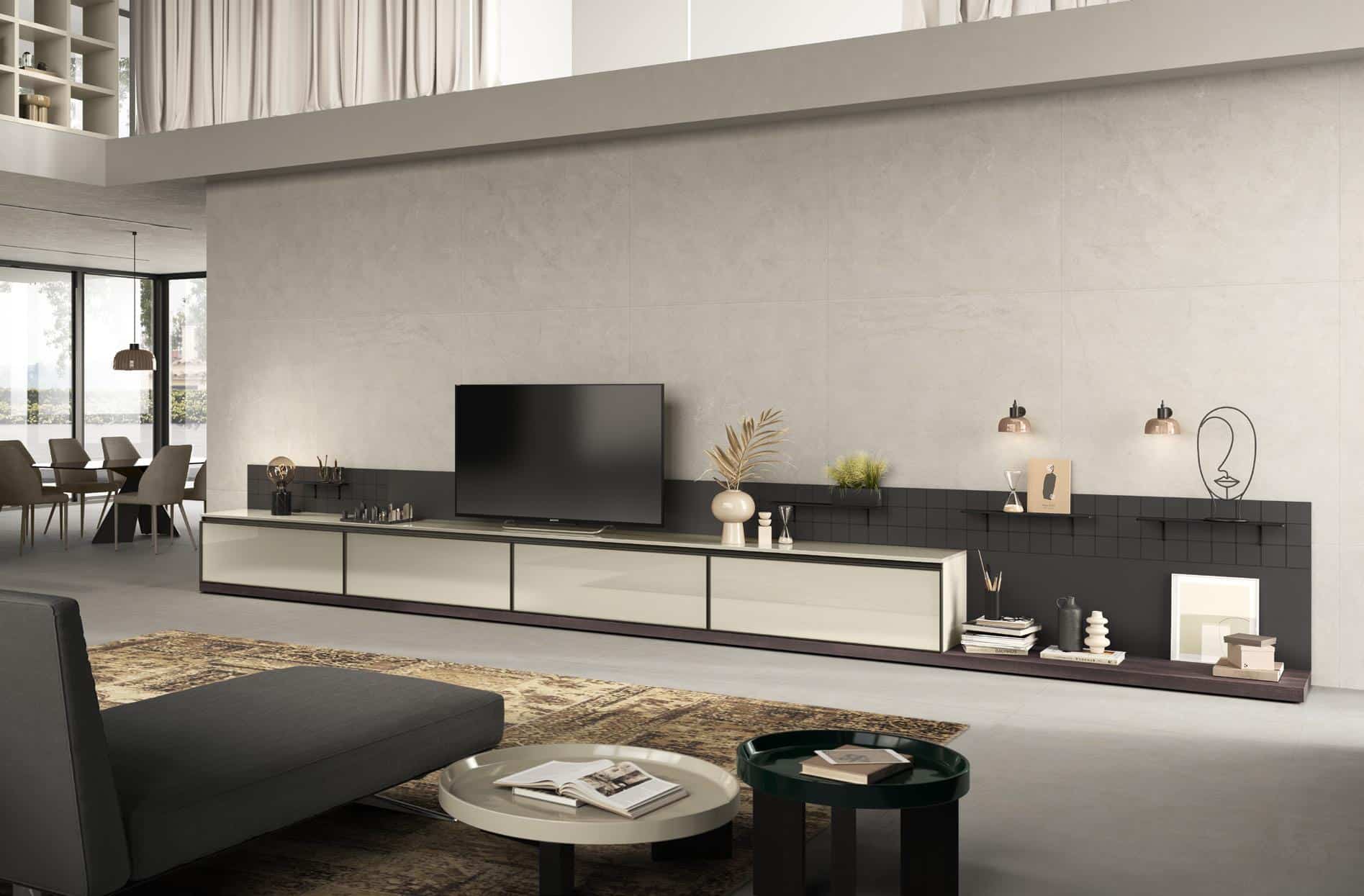 Modern living room with a sleek TV unit, minimalist decor, and a dining area in the background.