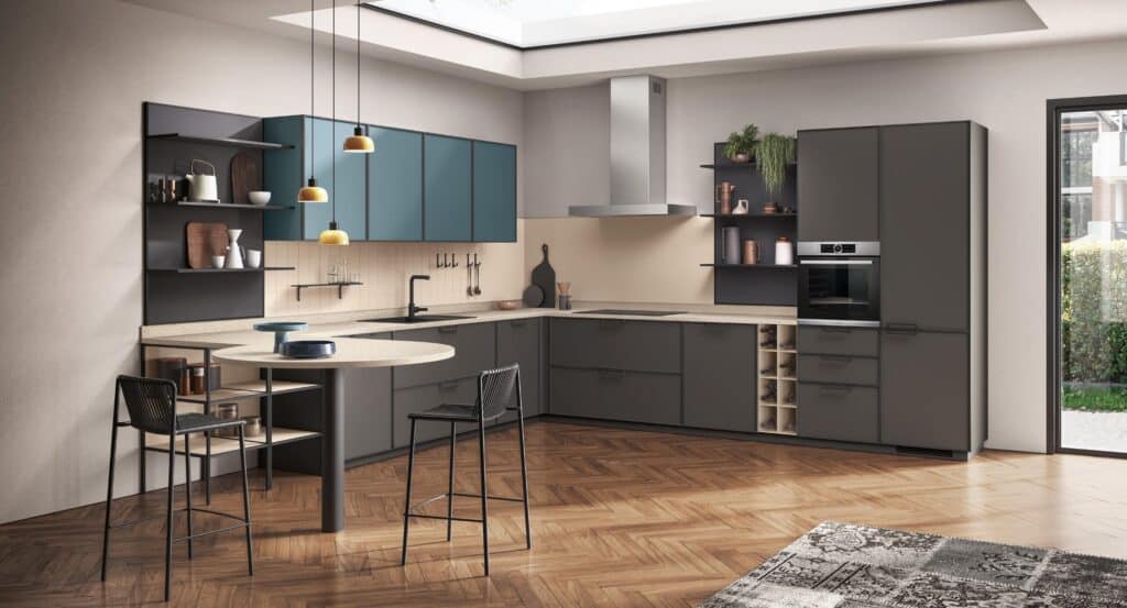 Modern kitchen with teal and gray cabinets, an island with bar stools, open shelving, built-in oven, and large window.