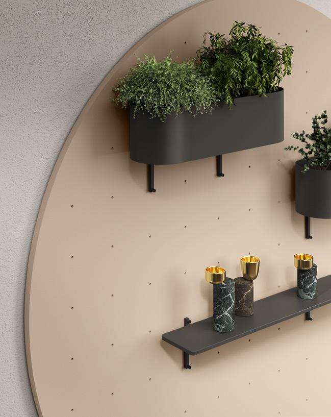 Wall-mounted plants and shelves with decorative items on a circular pegboard.
